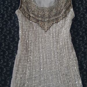 White sequined dress. Bead embroidered.
